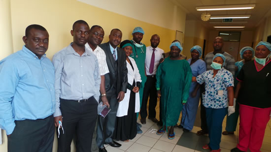 Doctors, nurses, students and patients gathered at National Hospital Abuja. Dr. Tanimu (4th from left) spent days with the staff, including Dr. Badejo, surgeon (2nd from left), and Dr. Olaomi, orthopedic and trauma surgeon (3rd from left). 