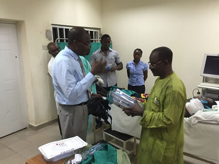 Dr Tanimu handing over gastrostomy tubes to Professor Malu, BSUTH, Nigeria